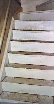 unpainted stairs before staging